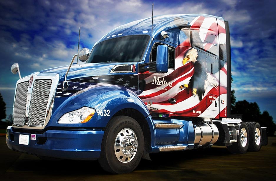 Exterior of a Melton flatbed truck with an American flag wrap.